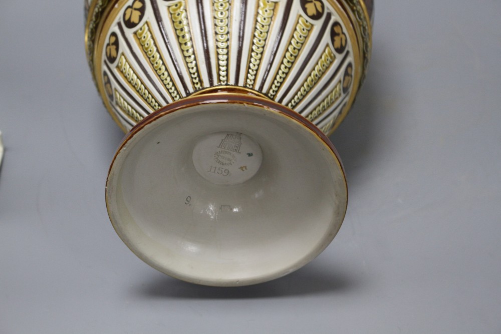 A large Villeroy and Boch Mettlach ewer, decorated with figures drinking, dancing and musicians, impressed 1159, height 45cm